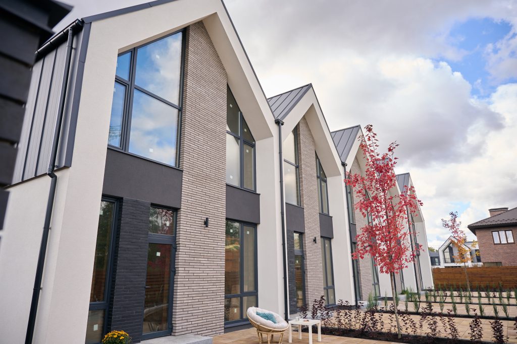 Contemporary townhouses standing in line in residential neighbourhood