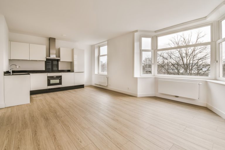 The interior of a beautiful room with a kitchen area